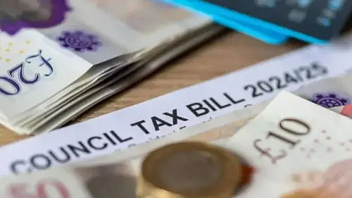 cash on table next to council tax bill